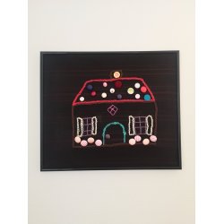 Pandekagehuset i sort ramme